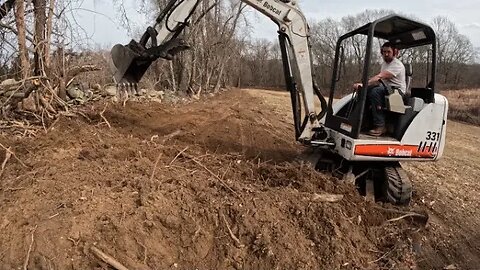 Finish Grading and Screening Topsoil in the Hayfield