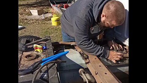 Working on the gas tanks on The ford