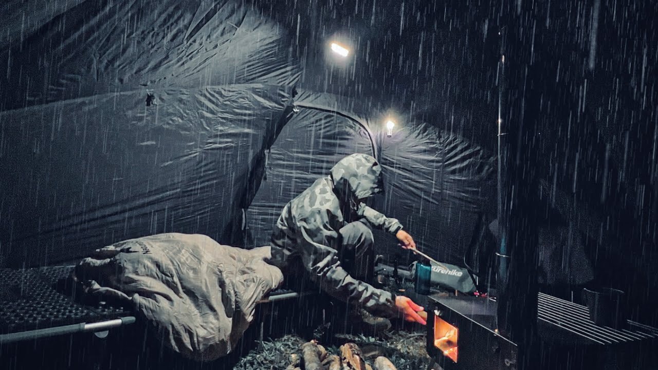 HOT TENT CAMP ALONE WITH WOOD STOVE IN TROPICAL RAINFOREST