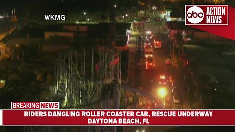 Florida firefighters working to rescue riders from dangling rollercoaster car