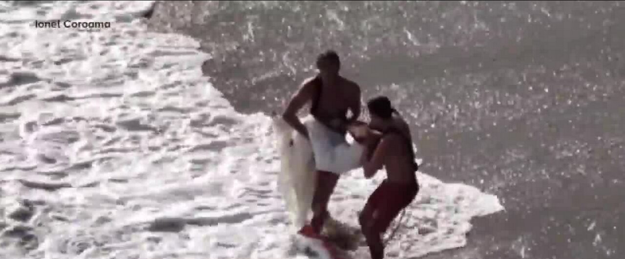 Bride and groom swept to sea by waves