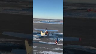 Alaskan bush pilot walking from plane