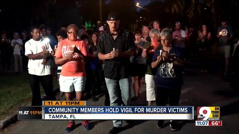 Community members hold vigil for murder victims
