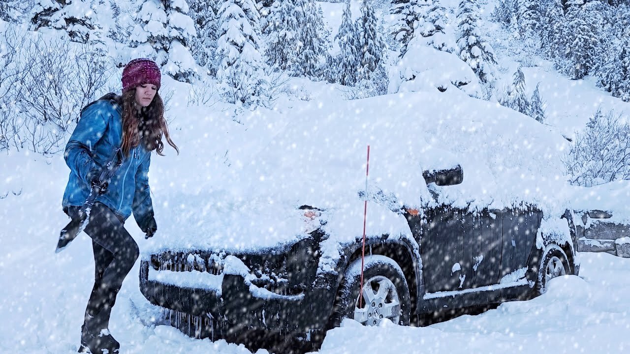 solo car camping in a snowstorm