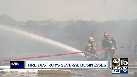 Fire destroys several businesses at Phoenix strip mall threatened homes