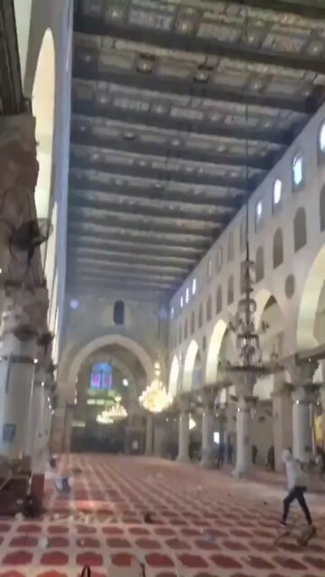 Israeli forces vandalizing windows Mosque so they can shoot Palestinians civilians inside