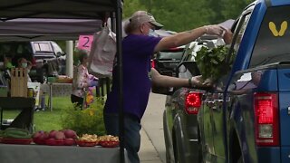 Customers visit drive-thru farmers' market