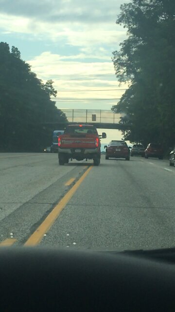 Distracted driver driving in the middle