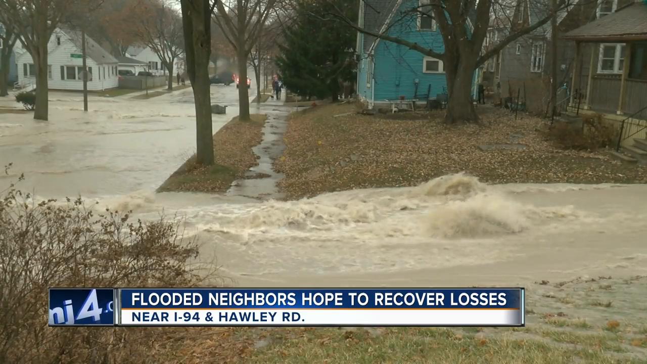 Flooded neighbors hope to recover losses