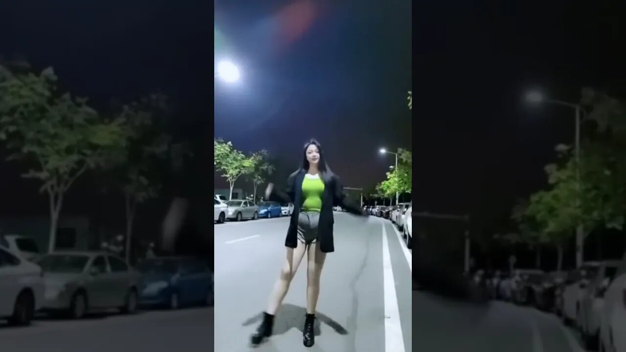 Chinese Girl Trys To Dance In Street Without Much Success