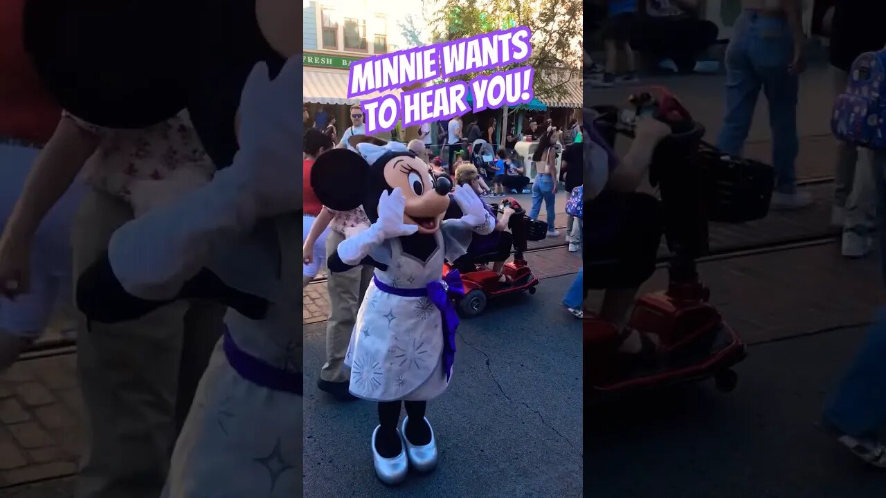 Minnie Mouse working the crowd before the parade #disneyland #minniemouse #magichappens