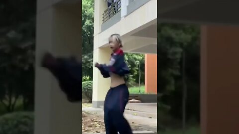 Bare Bellied Chinese Girl Dances Outside Her House