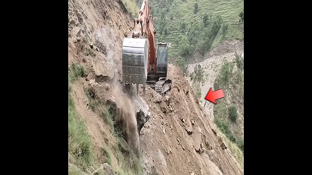 excavator working on cliff( dangerous work)