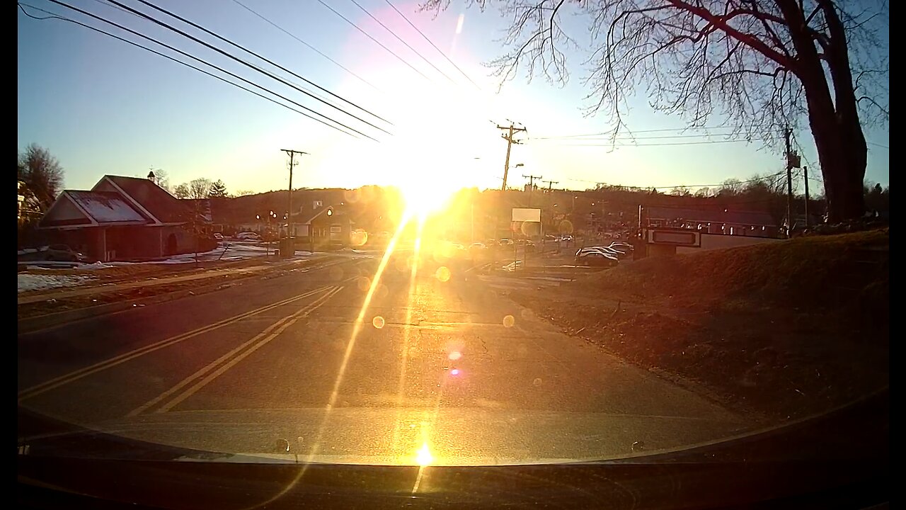 Blinding sun glare hides pedestrian on road