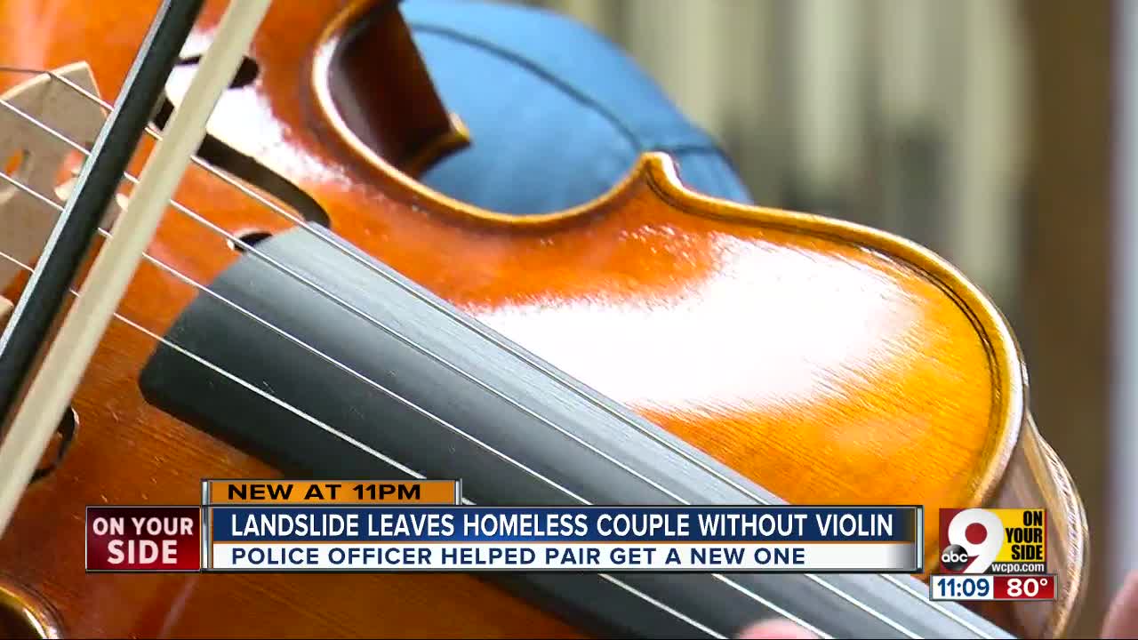 Cincinnati officer buys new violin for homeless couple