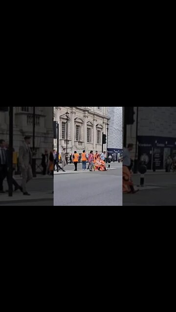 Man walks through stop oil banner #extinctionrebellion