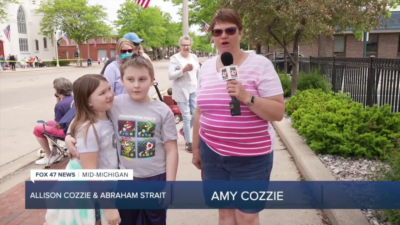 For some, like Allison Cozzie and Abraham Strait, this parade was a long-awaited reunion.