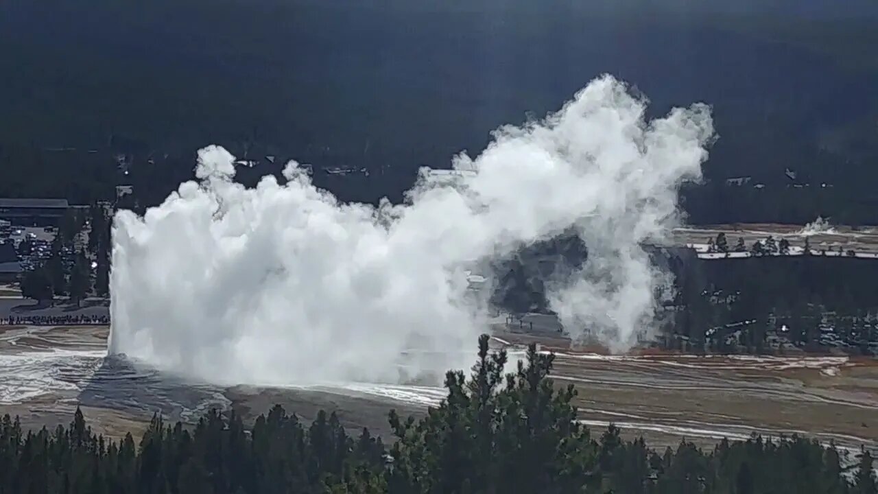 Old Faithful erupting, seen from Observation Point