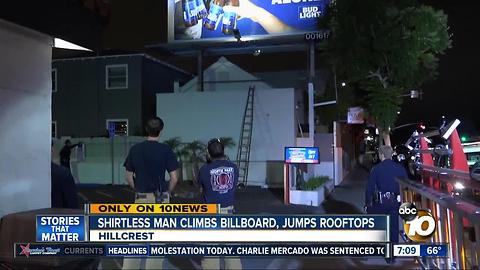 Shirtless man climbs billboard, jumps rooftops