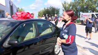 Repair shop gifts car and cash to family in need