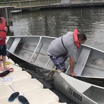 Guy Struggles To Get In Rowing Boat