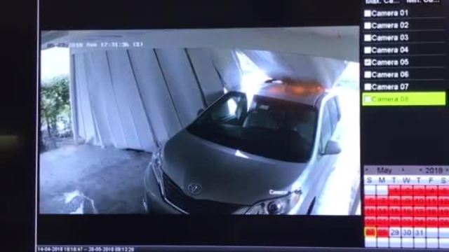 Surveillance video shows carport falling on vehicle
