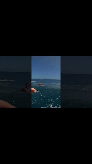 GIANT OPEN OCEAN WAVE SLAMS SHALLOW REEF AND PEOPLE