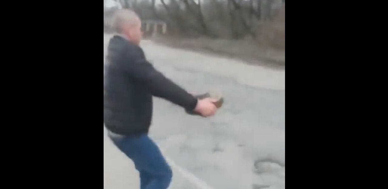 Ukrainian Man Removes Mine From Roadway While Smoking Cigarette