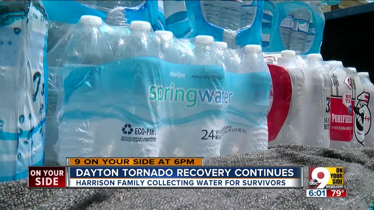 Harrison Family collects water for Dayton