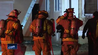 Crews fight an overnight house fire in De Pere