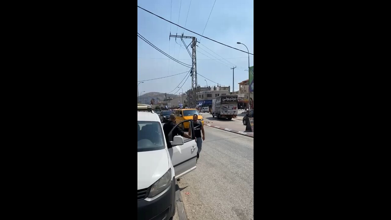 Israelis Waving Flags in Arab Village Where they have constantly stones Israeli motorists