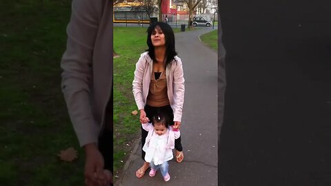 Beautiful mommy is teaching her baby girl how to walk