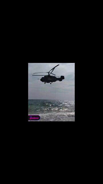 Russian (anti-submarine) Ka-27 says "hello" to Crimean beachgoers