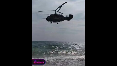 Russian (anti-submarine) Ka-27 says "hello" to Crimean beachgoers