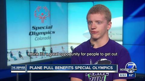 Volunteers lining up for the chance to pull a 164,000 pound plane for Special Olympics Colorado