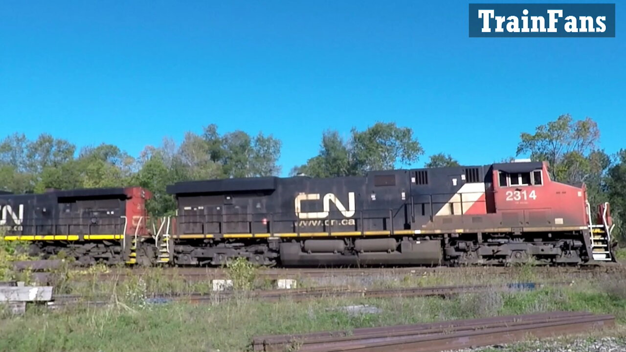 Manifest Train CN 2314 & CN 2727 Locomotives East Through Woodstock's Carew Diamond