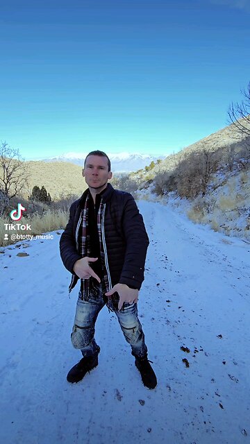 Like a Slim Shady mixed with Andrew Tate