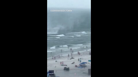 Footage captures waterspout ripping through crowded beach #Shorts