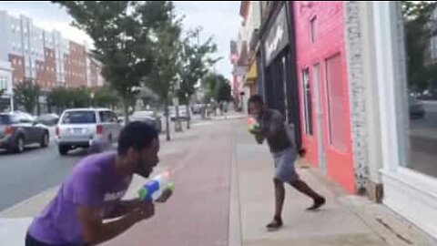 Youth challenge strangers to water gun duels