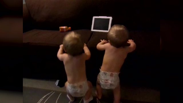 "Twin Babies Dancing in Diapers"