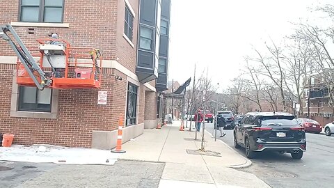brick masons replacing some damaged bricks
