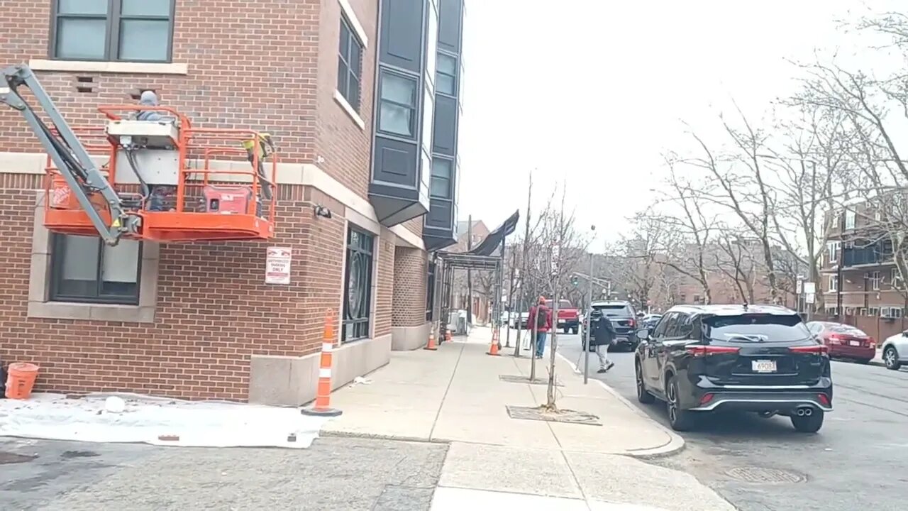 brick masons replacing some damaged bricks