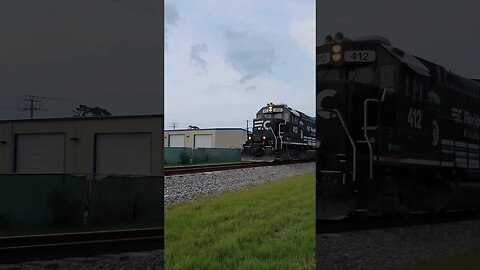 Florida East Coast Railway FEC-105 returning north as 206 at Daytona Beach Golf Club June 18 2023