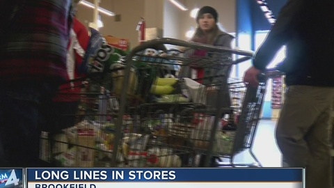Shoppers pack grocery store in preparation for snow storm