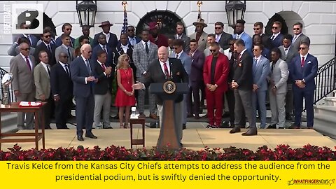 Travis Kelce from the Kansas City Chiefs attempts to address the audience from the presidential