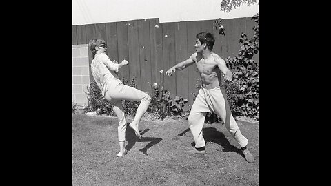 Cross kick Studio Films Bruce Lee and Linda practice in yard