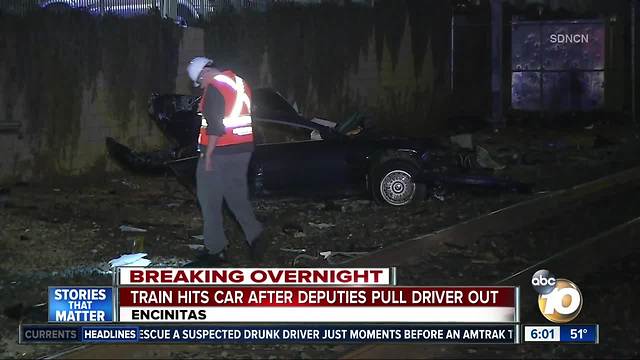 Train hits car after driver pulled to safety