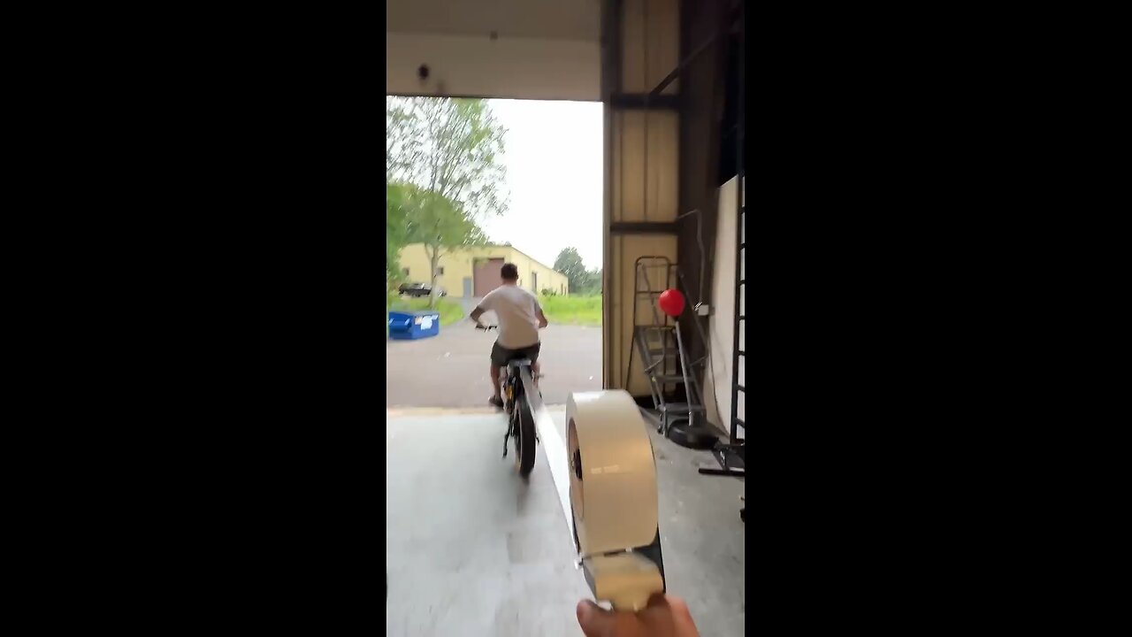 Guy attaches packing tape to the back of his friend's bike!