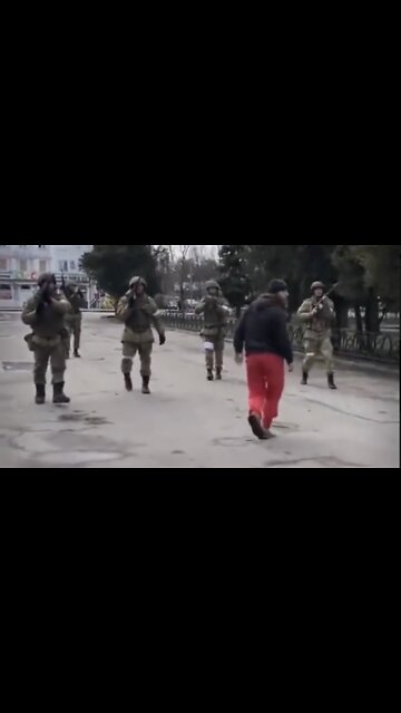 Ukrainians March Toward Russian Soldiers While Getting Shot At