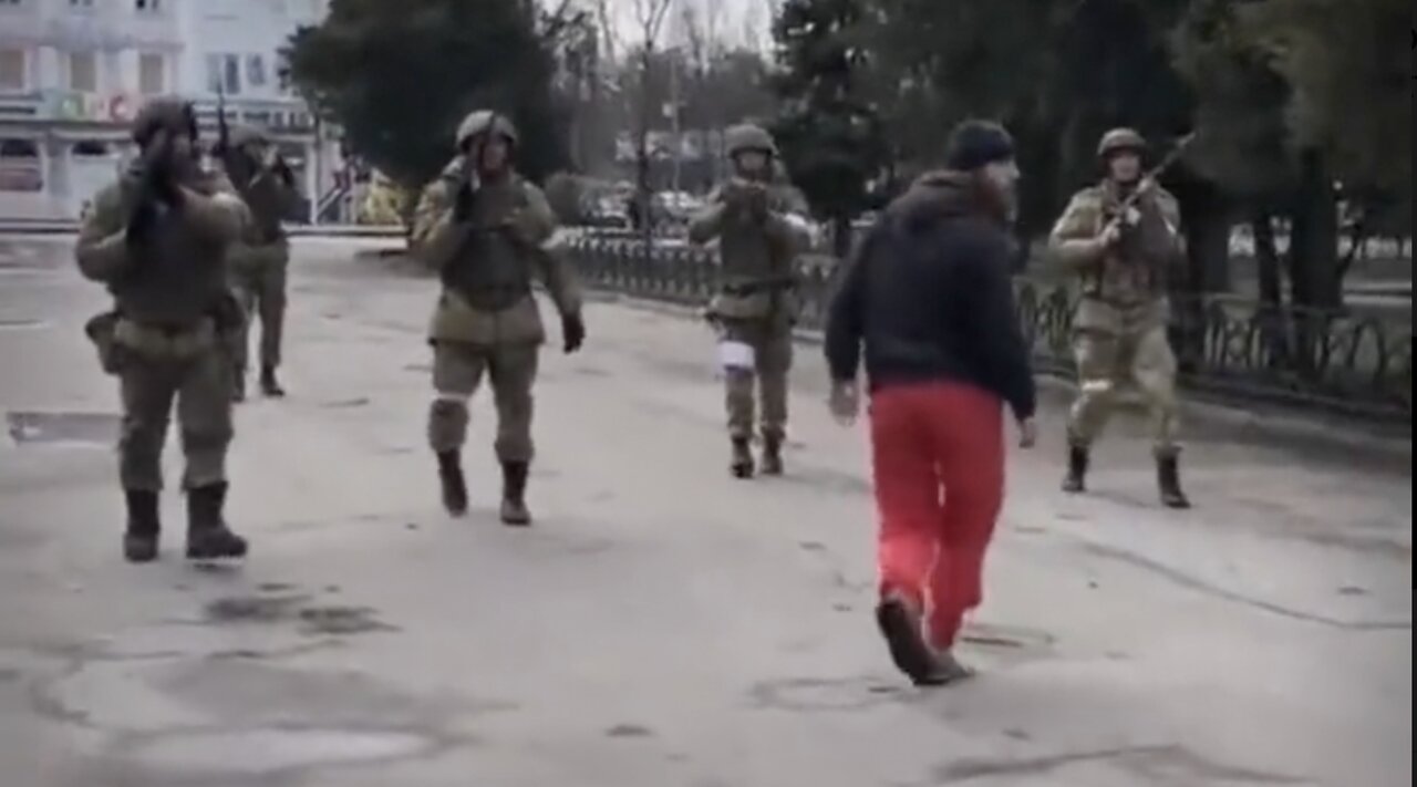 Ukrainians March Toward Russian Soldiers While Getting Shot At